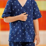 Child wearing blue organic cotton kurta with white block print and matching pants