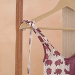 Organic cotton kids dress with purple elephant block print on hanger